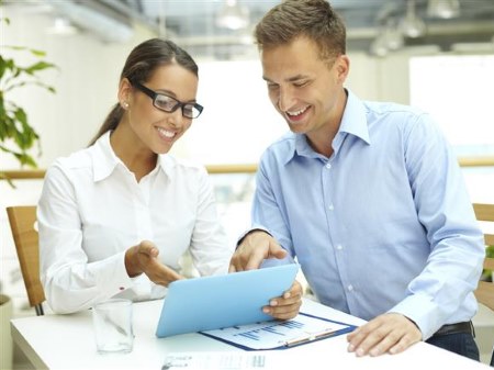 Couple Reviewing Assurance Abstract Paperwork